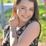 Cute brunette sweetie strips down in public and spreads her cunt