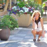 Elegant blonde flashes naked upskirt in public and toys herself with a dildo
