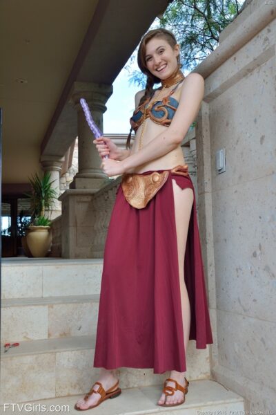 Hot teen in harem costume toys pussy and ass outdoors when nobody's looking Image #12