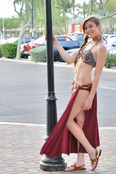Hot teen in harem costume toys pussy and ass outdoors when nobody's looking Image #9