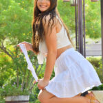 Long-haired glamour babe Aria flashing a pantyless upskirt in public
