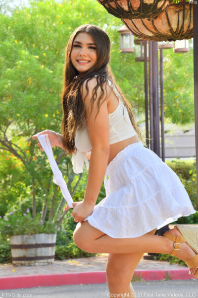 Long-haired glamour babe Aria flashing a pantyless upskirt in public Image #16
