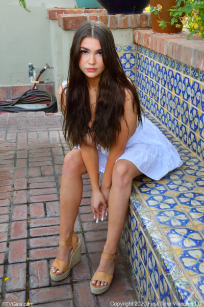 Long-haired glamour babe Aria flashing a pantyless upskirt in public Image #5