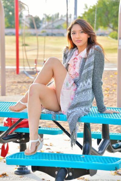 Sweet teen Melody flaunts her tasty cunt and round ass in the park Image #1