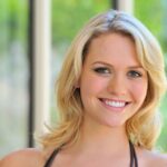 Teen beauty with blonde hair changes into a short dress for public flashing