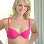 Teen beauty with blonde hair changes into a short dress for public flashing