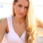Blonde babe Viktoria doffs her white dress and toys herself in the park