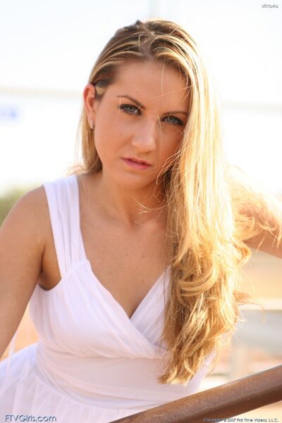 Blonde babe Viktoria doffs her white dress and toys herself in the park Image #11