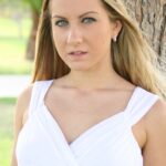Blonde babe Viktoria doffs her white dress and toys herself in the park