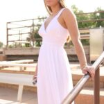 Blonde babe Viktoria doffs her white dress and toys herself in the park