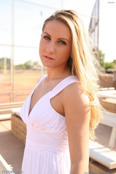 Blonde babe Viktoria doffs her white dress and toys herself in the park Image #9