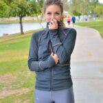 Cute jogger Reese undresses and shows her tiny tits and flexibility outdoors
