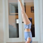 Horny yoga lover Lila sticks a heel in her snatch before practicing half naked