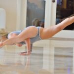 Horny yoga lover Lila sticks a heel in her snatch before practicing half naked