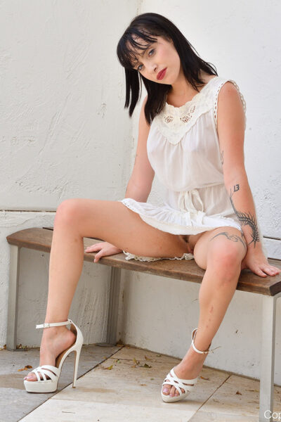 Pretty brunette Vanna fists her vagina on a sofa in socks Image #6
