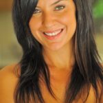 Raven-haired babe Annalisa peels her bikini off and rubs her clit by the pool