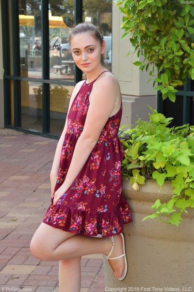 Cute babe posing in public before toying her pussy on the stairs of her home Image #1