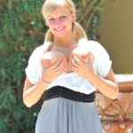 Cute girl with amazing boobs Alice fills her vagina with a cucumber outdoors