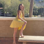 First timer flashes her naked body underneath clear skies in a yellow dress