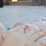 Glamour babe Jessie shows off her shaved pussy & toys with a dildo by the pool