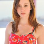 Pretty babe Victoria unveils her wonderful tits in a sexy outdoor striptease