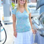 Hot blonde Alice uncovers her grand tits at a petrol station & on public steps
