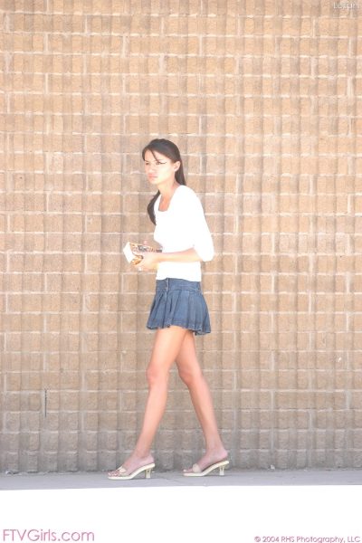 Sexy babe in short skirt Leilani reveals her hot boobs and pussy in public Image #1