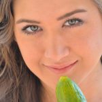 Cute brunette Shannon exposes her twat and slides a cucumber in it in public