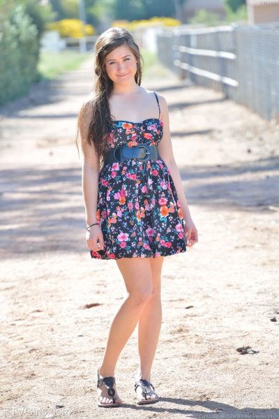 Cute brunette Shannon exposes her twat and slides a cucumber in it in public Image #1