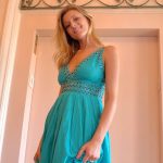 Glamorous babe in a sexy dress Carli flashing an arousing upskirt in public