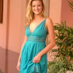 Glamorous babe in a sexy dress Carli flashing an arousing upskirt in public