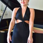 Sexy blonde Jill masturbates with a white dildo while sitting at the piano
