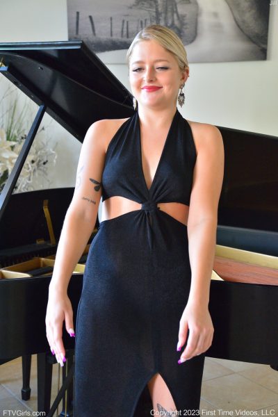Sexy blonde Jill masturbates with a white dildo while sitting at the piano Image #2