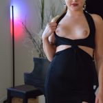 Sexy blonde Jill masturbates with a white dildo while sitting at the piano