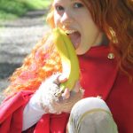 Tiny redhead teen Dolly enjoys solo masturbation with bananas in the forest