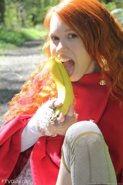 Tiny redhead teen Dolly enjoys solo masturbation with bananas in the forest Image #11