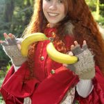 Tiny redhead teen Dolly enjoys solo masturbation with bananas in the forest