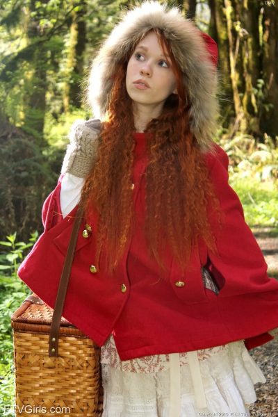 Tiny redhead teen Dolly enjoys solo masturbation with bananas in the forest Image #1