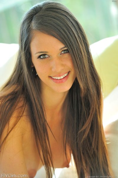 Alluring American babe Tiffany toys her shaved pussy with a veggie Image #7