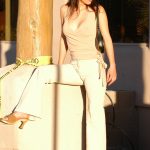 Alluring babe Sasha exposes her big boobs and her tight ass outdoors