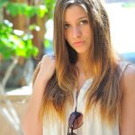 Naughty teen girl takes off her clothes on sidewalk outside her house
