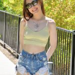 Amateur girl Venus flashes her small tits while outdoors before going nude