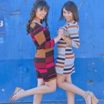 Sweet teens Athena & Mindy flash their asses outdoors before indoor fingering