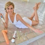 Blonde chick with short hair and nice legs fists and toys her own asshole