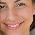 Cute brunette teen in a sexy white dress gets naked on the street