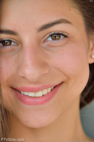 Cute brunette teen in a sexy white dress gets naked on the street Image #9