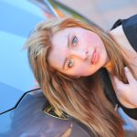 Horny beauty Mia unveils her sweet muff and poses in front of a Lamborghini