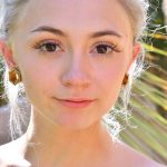 Skinny blonde Larissa exposes her tiny tits and small ass in the park