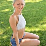 Skinny blonde Larissa exposes her tiny tits and small ass in the park