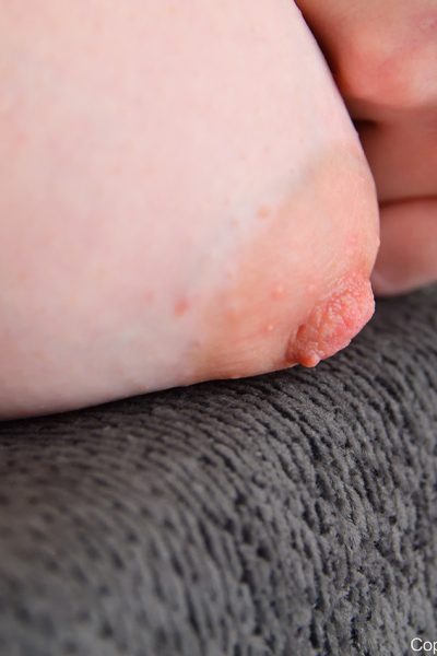 Sweet redhead Jackie toys her pink pussy before donning red heels Image #11